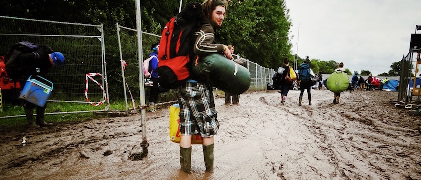 backpacker standing in mud
